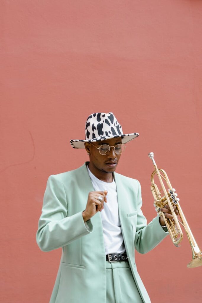 Man in Teal Suit Holding Trumpet